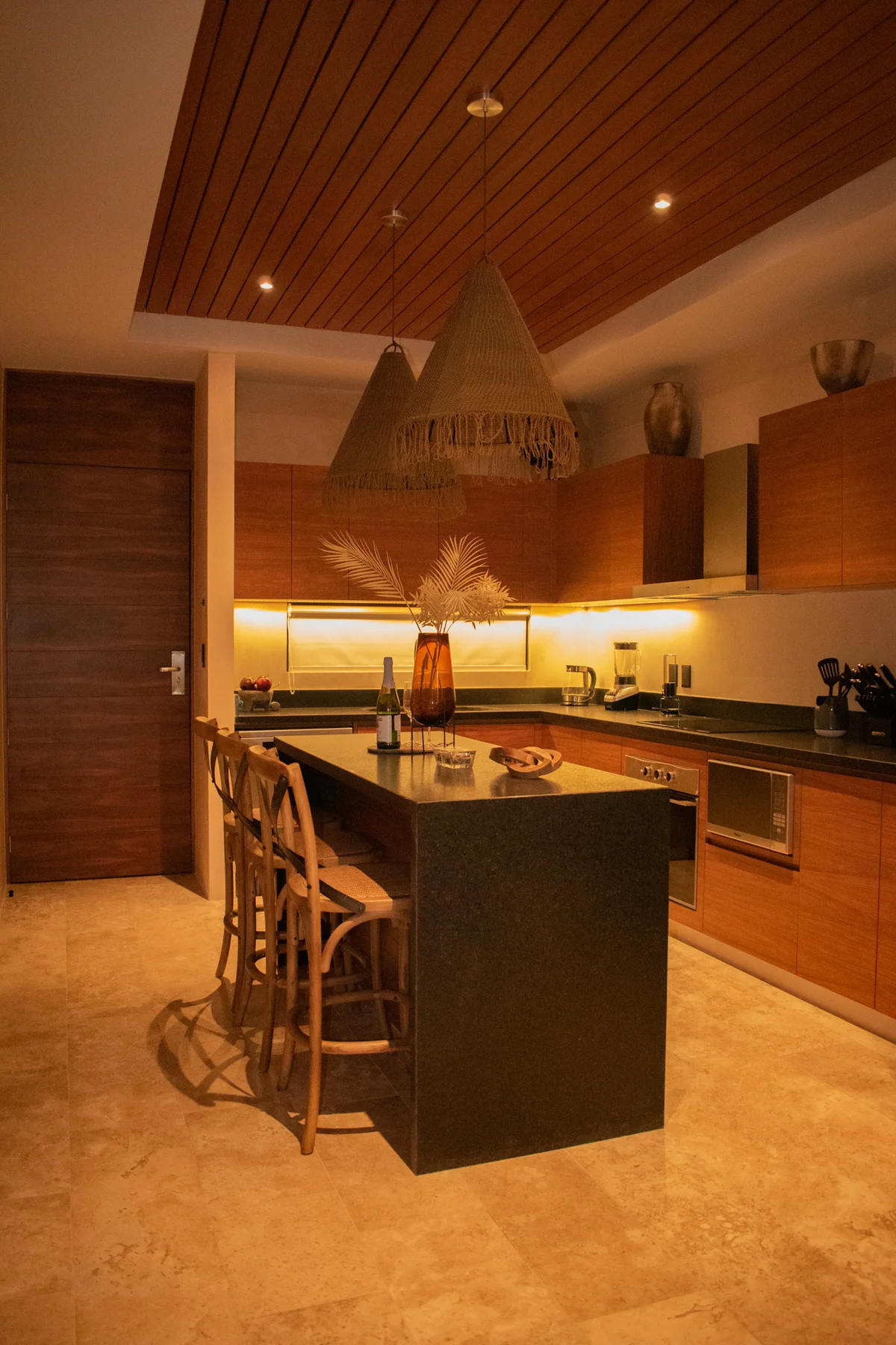 View of Modern Kitchen at Deja Vu, showcasing Kitchen Island, Breakfast Bar.