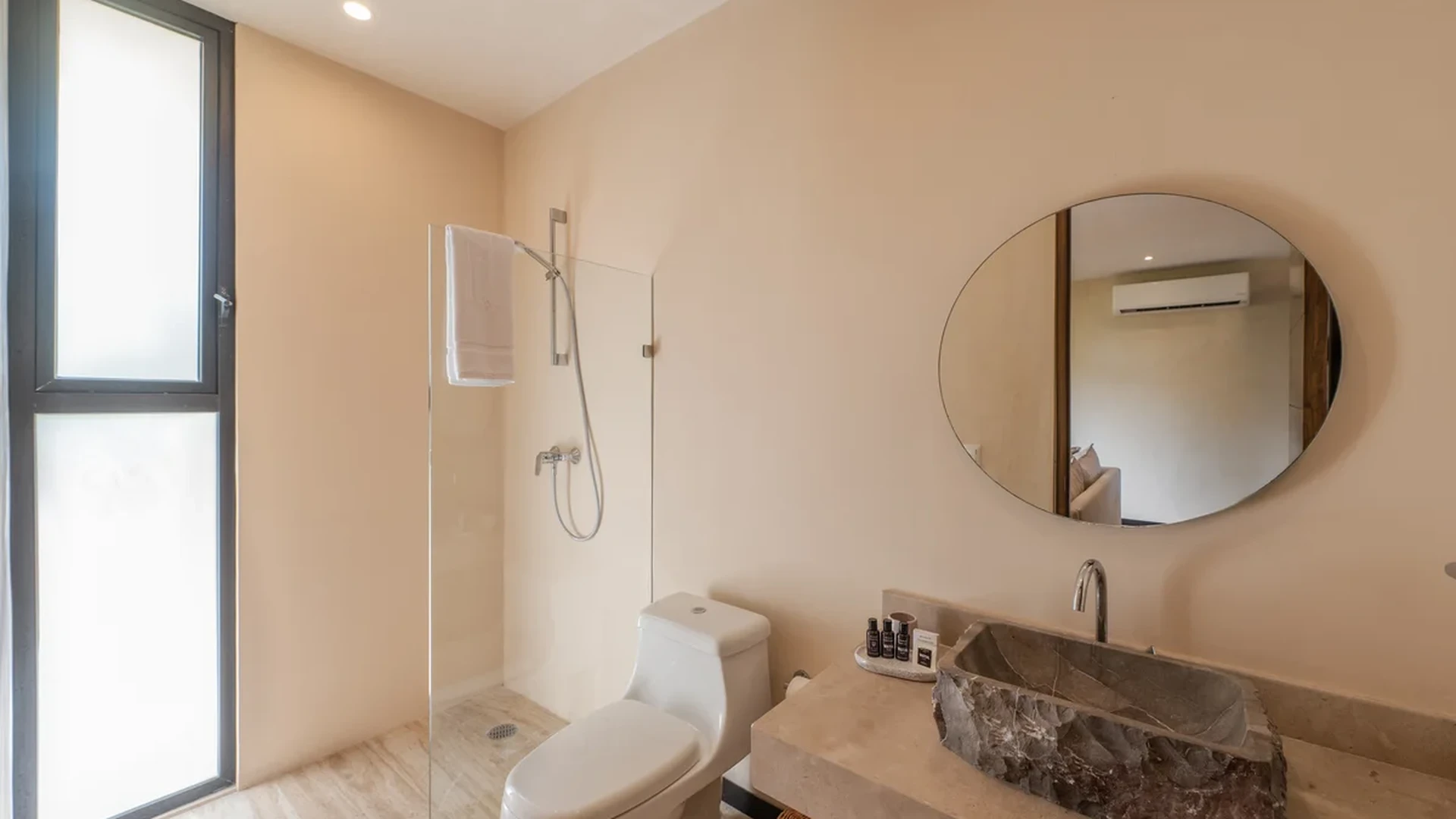View of Modern Bathroom at Ophelia, showcasing Stone Vessel Sink, Walk-In Shower.