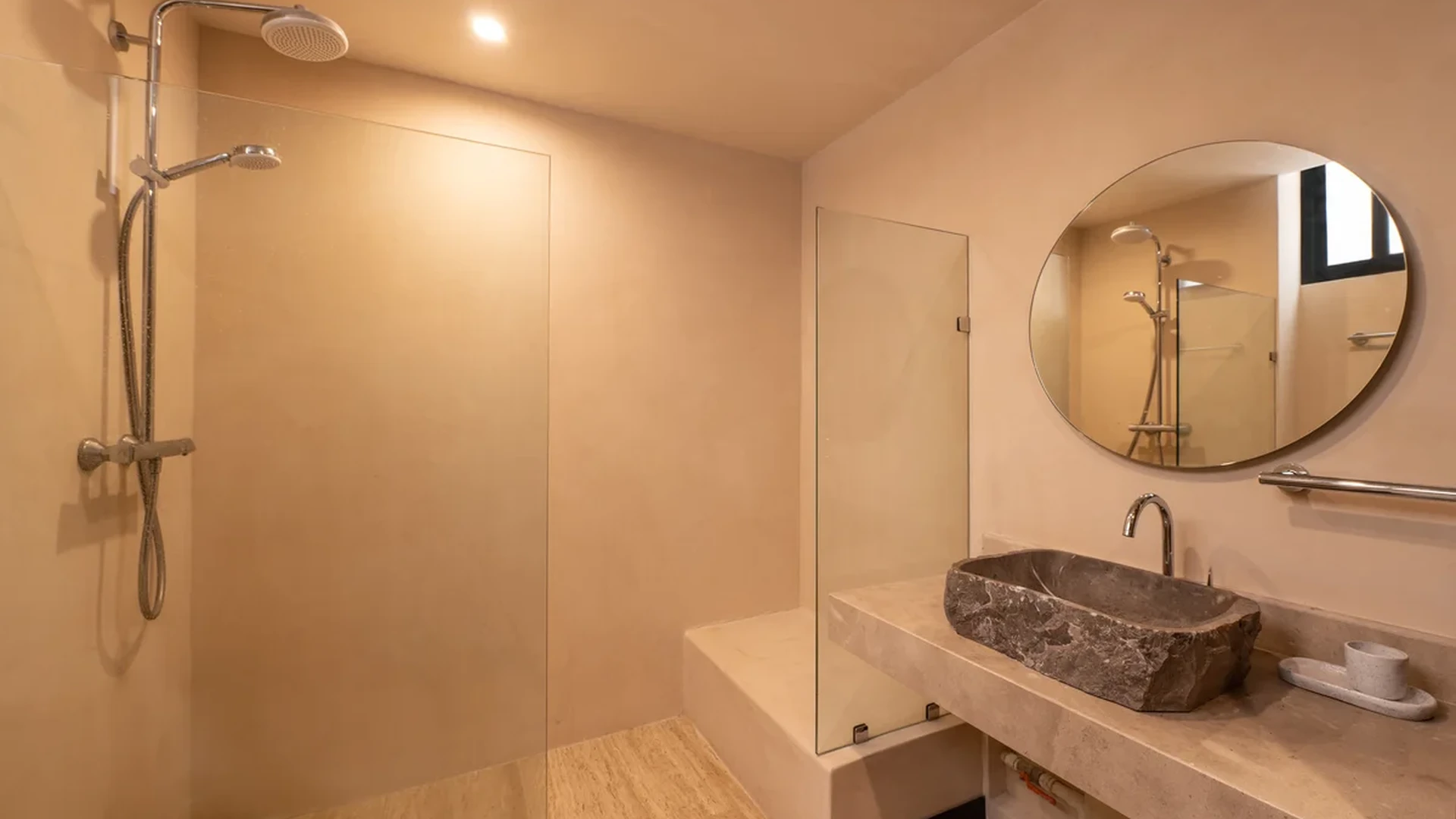 View of Modern Bathroom at Ophelia, showcasing Stone Vessel Sink, Walk-in Shower.