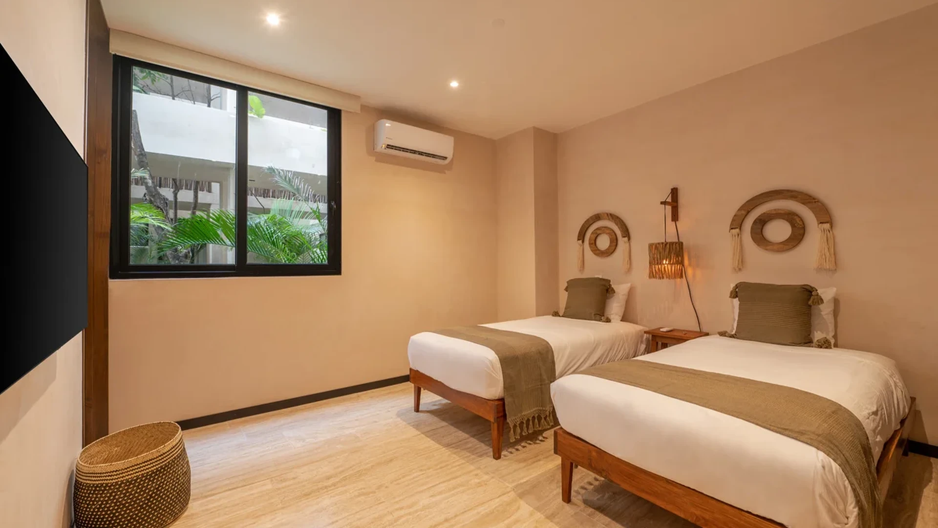 View of Guest Bedroom at Ophelia, showcasing Twin Beds, Bohemian Decor.