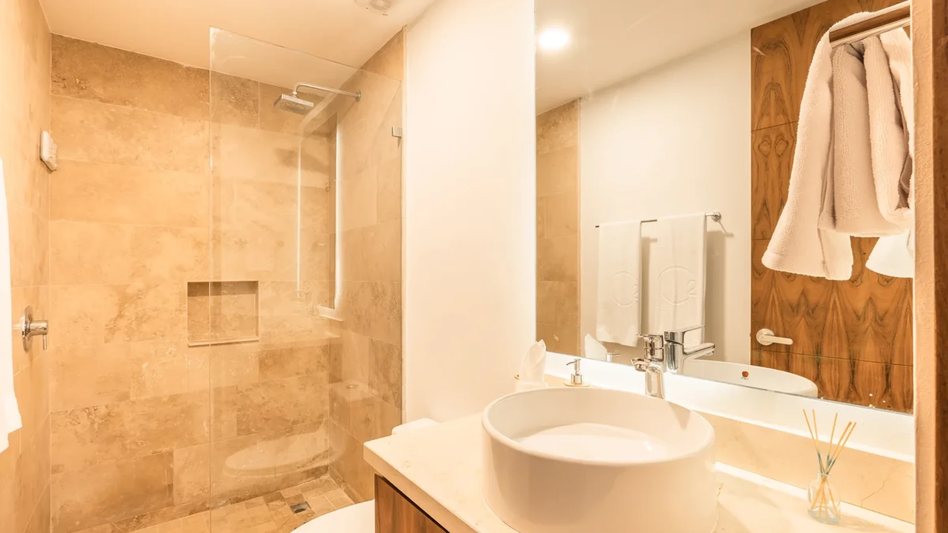 View of Modern Bathroom at Monarca, showcasing Vessel Sink, Stone Tiling.