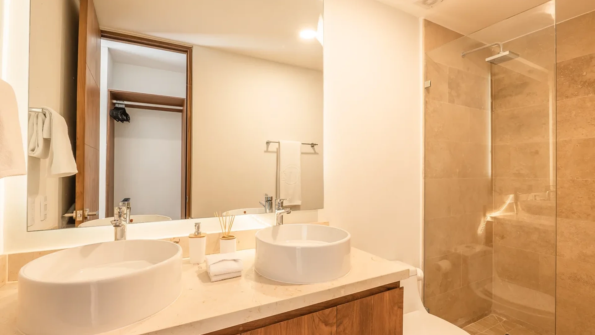 View of Modern Bathroom at Monarca, showcasing Double Vanity, Vessel Sinks.