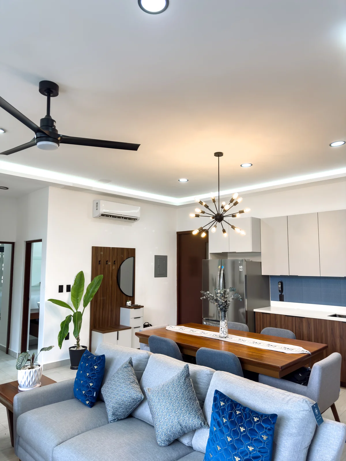 View of Open Concept Living at Blue Water, showcasing Modern Interior Design, Living and Dining Area.