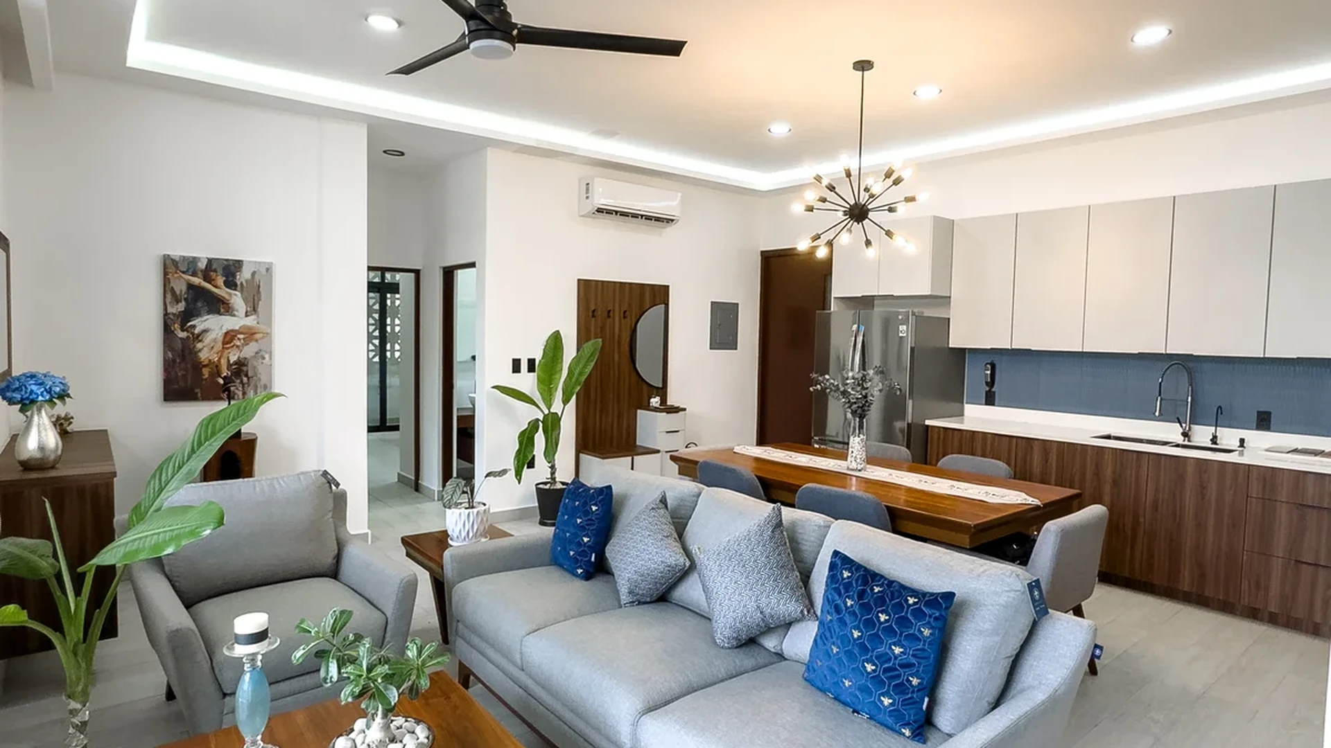 View of Open Concept Living at Blue Water, showcasing Modern Kitchen, Living and Dining Room.