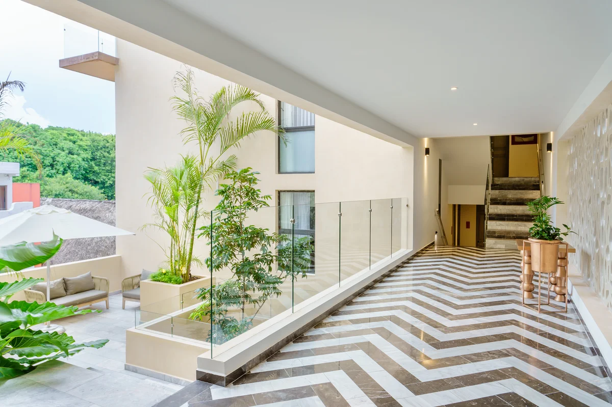 Image of Lounge at Singular Joy, featuring Modern Architecture, Chevron Marble Flooring.