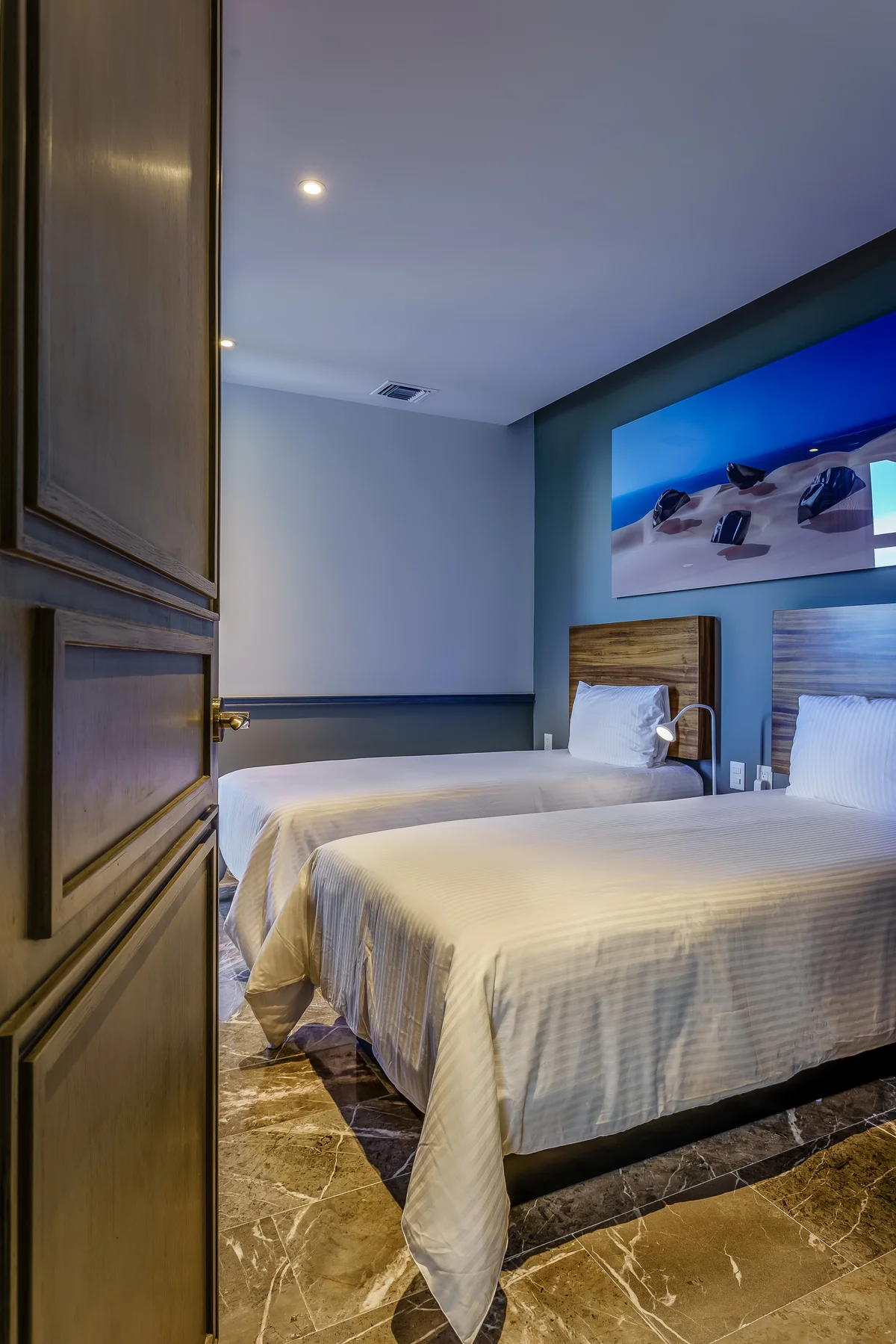 View of Bedroom at Singular Joy, showcasing Modern Interior, Marble Flooring.