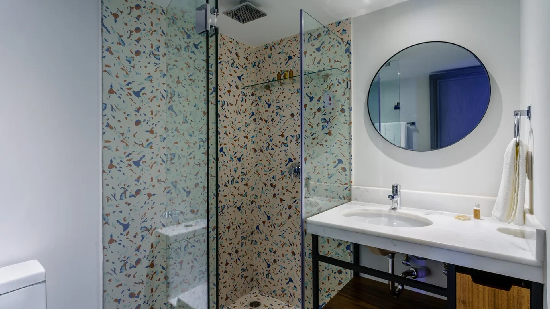View of Modern Bathroom at Singular Joy, showcasing Terrazzo Tile, Walk-in Shower.
