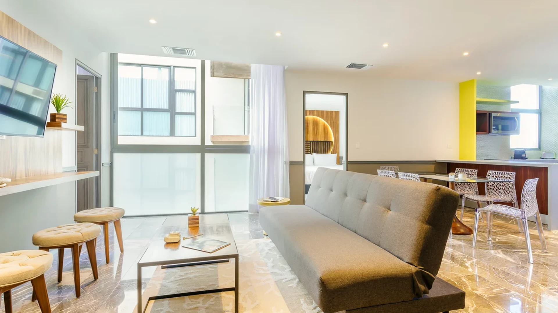 View of Modern Living Room at Singular Joy, showcasing Open Concept, Marble Flooring.
