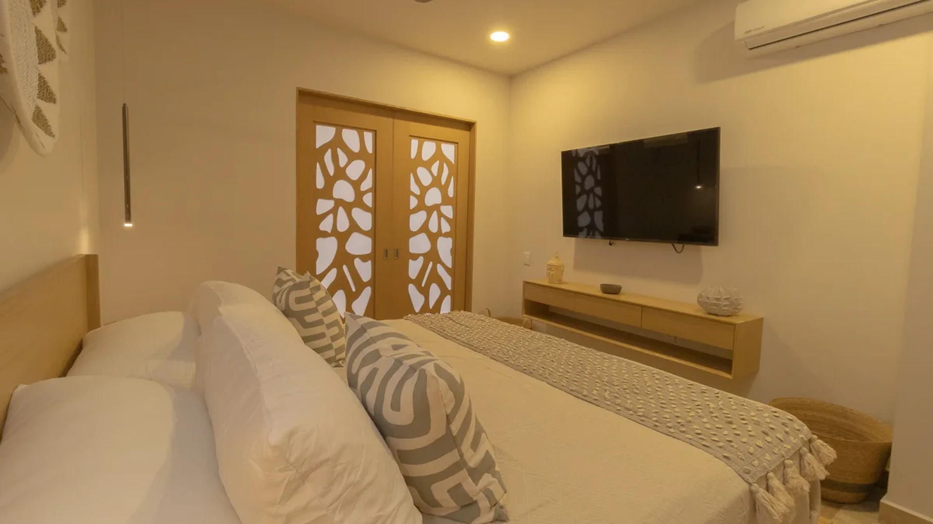 View of Modern Bedroom at Vibbe, showcasing Neutral Decor, Wood Accents.