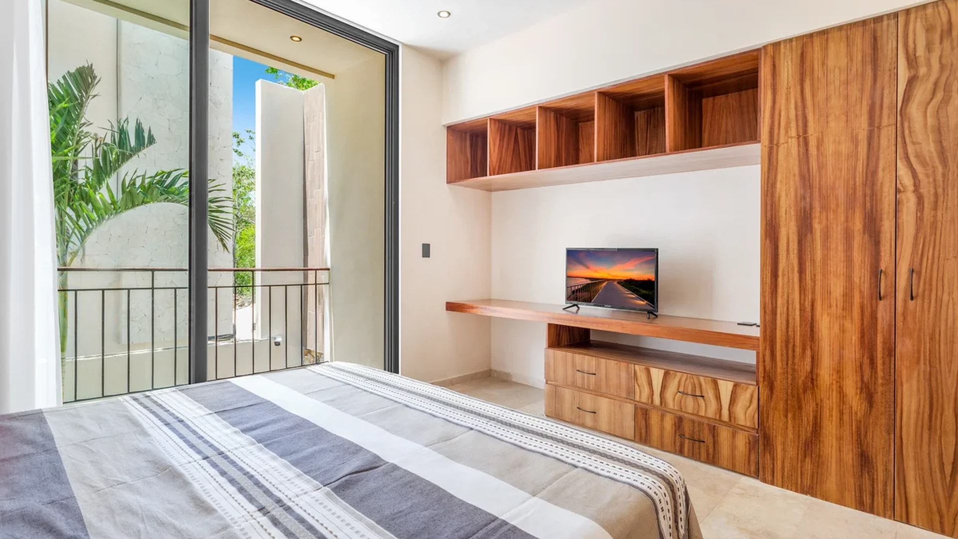 View of Bedroom at Sands Tulum, showcasing Modern Design, Wood Furniture.