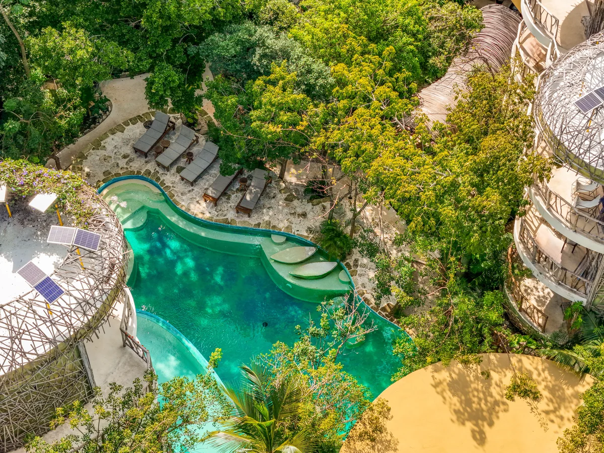 Image of Swimming Pool at Kan Tulum, featuring Swimming Pool, Tropical Landscape.