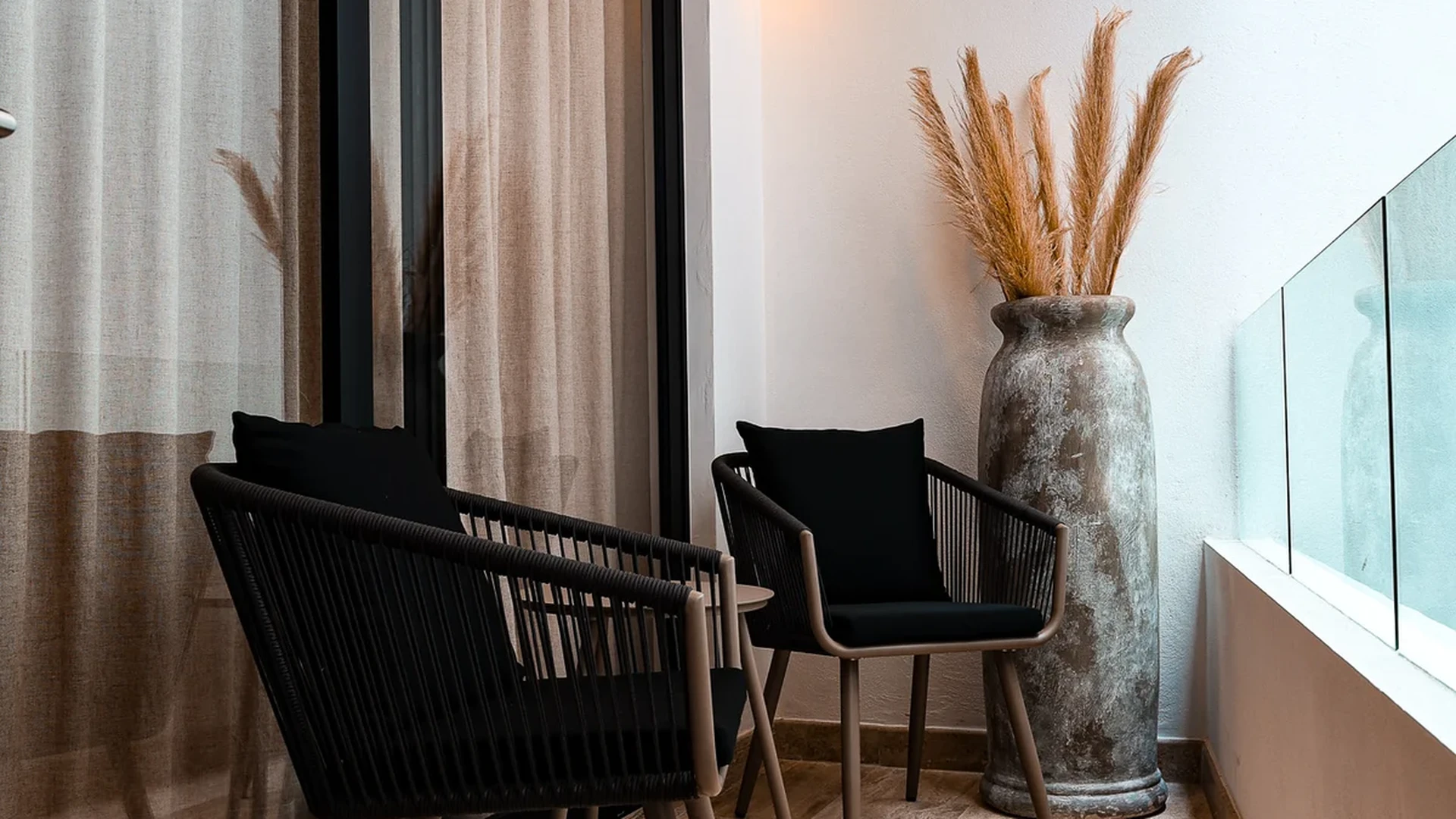 View of Private Balcony at Duna, showcasing Outdoor Seating, Modern Design.