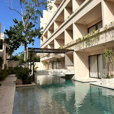 Explore Casa Makram, a serene oasis in Tulum. With its unique blend of innovative architecture and natural surroundings, discover the perfect retreat.