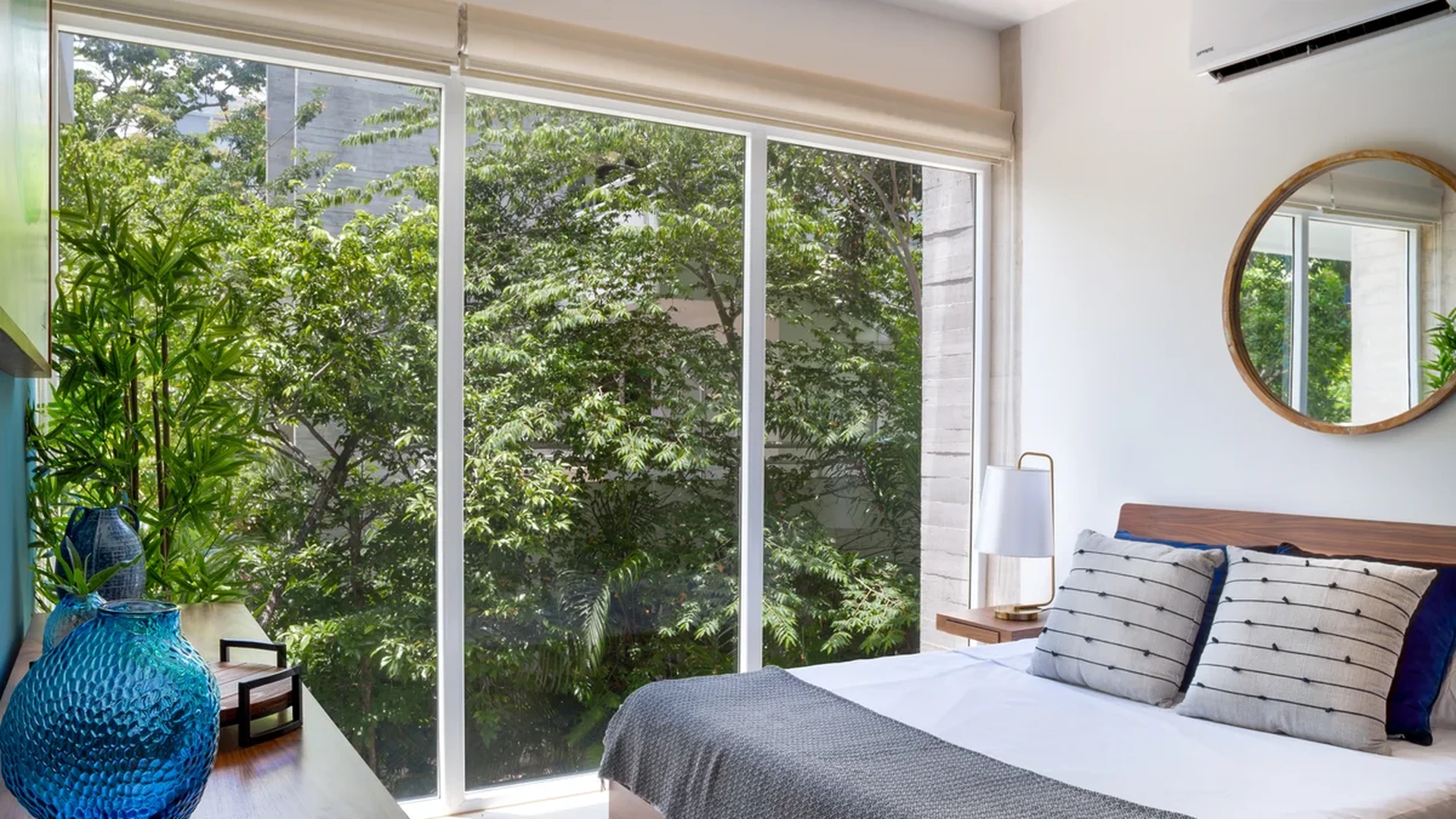 View of Modern Bedroom at Tao Tulum, showcasing Contemporary Design, Large Windows.