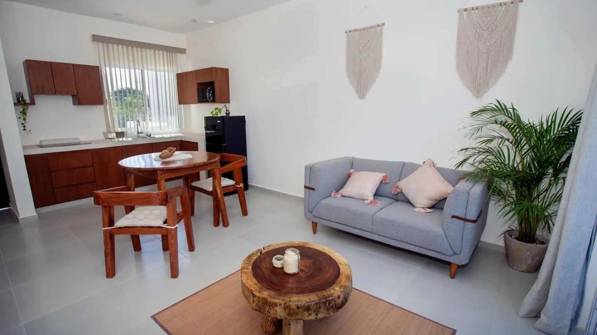 View of Open Concept Living at Triángulo, showcasing Modern Kitchenette, Cozy Living Room.