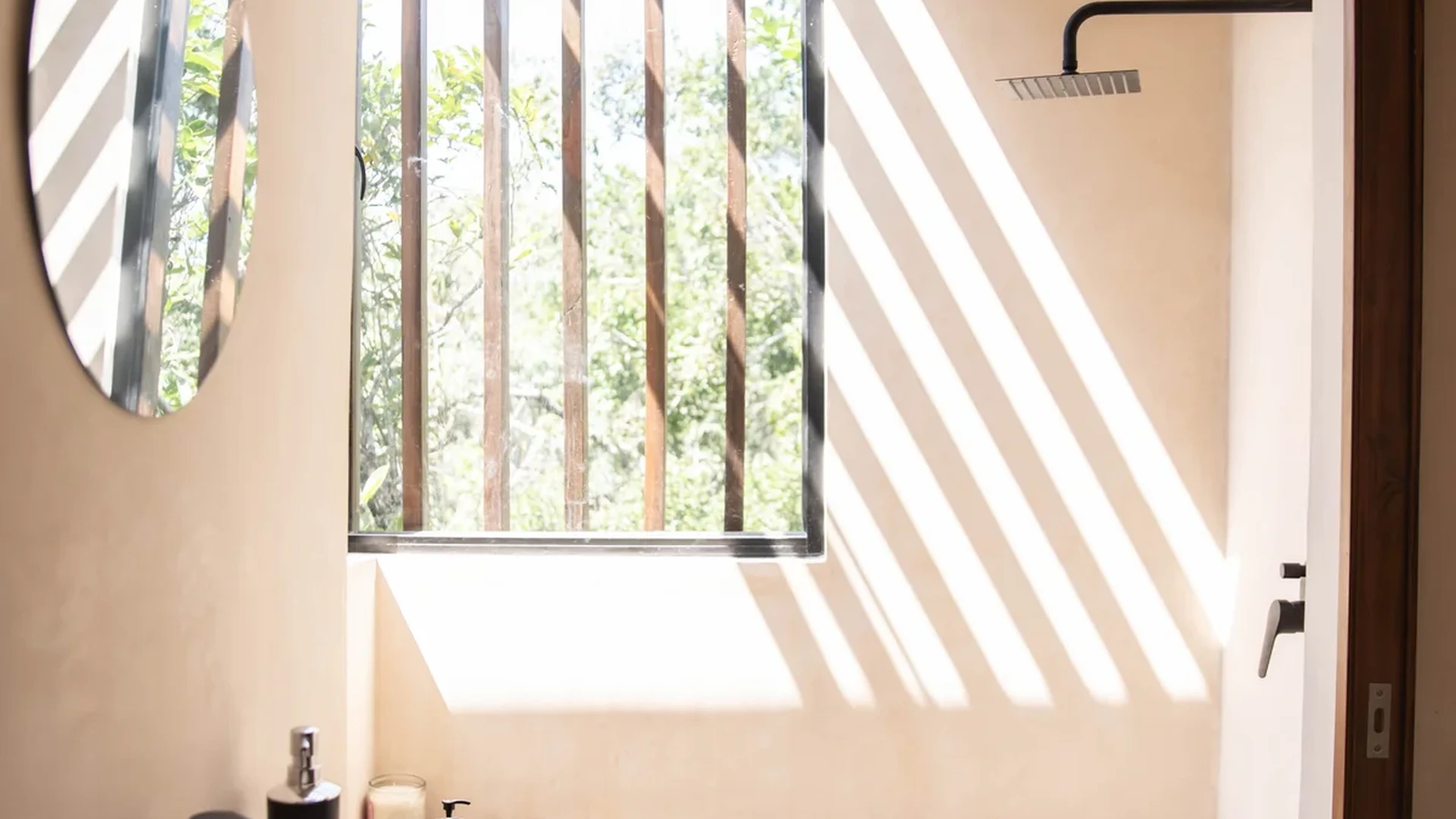 View of Modern Bathroom at Afra Jungle, showcasing Natural Light, Rain Shower.