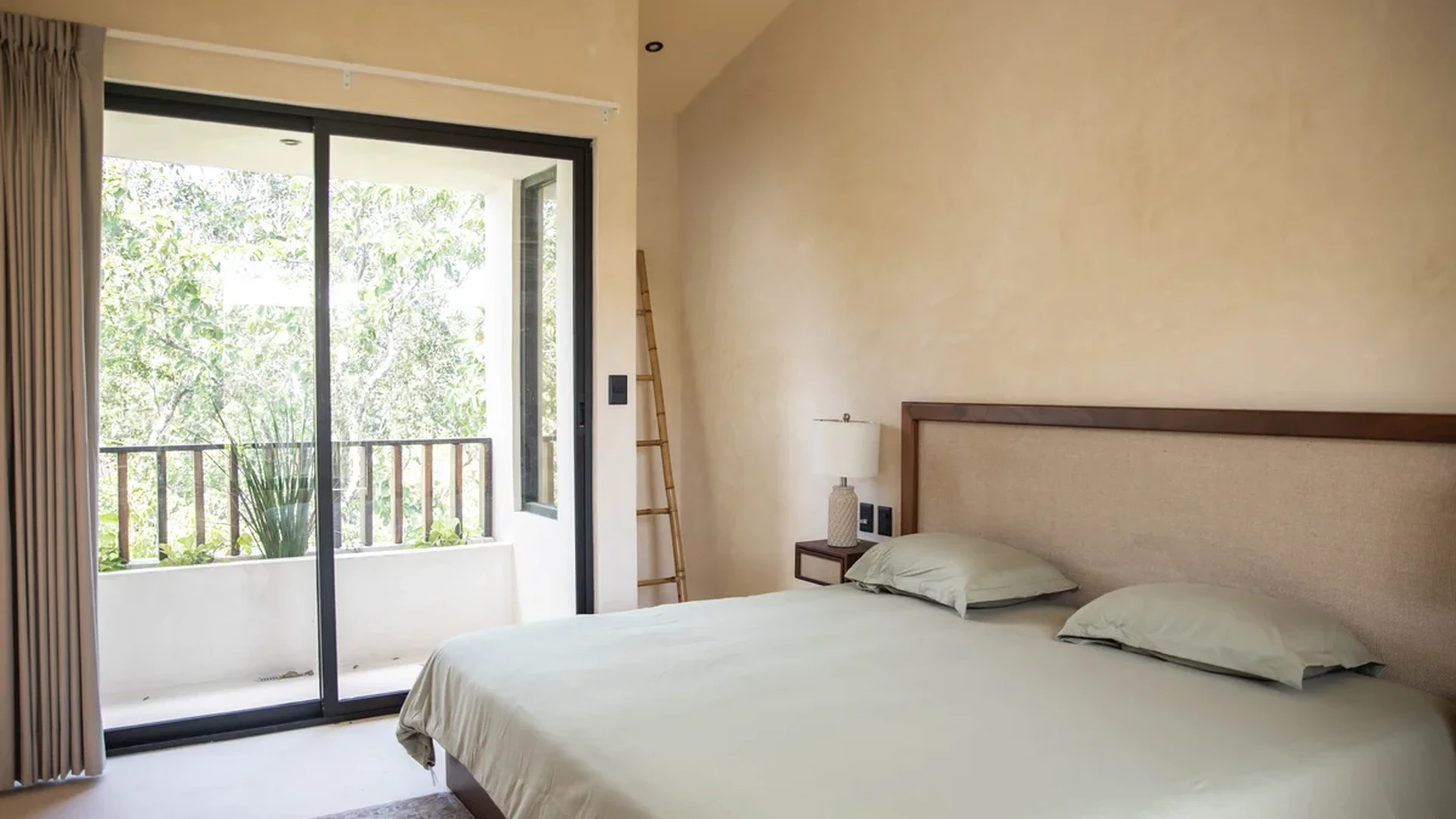 View of Modern Bedroom at Afra Jungle, showcasing Spacious Bedroom, Private Balcony.