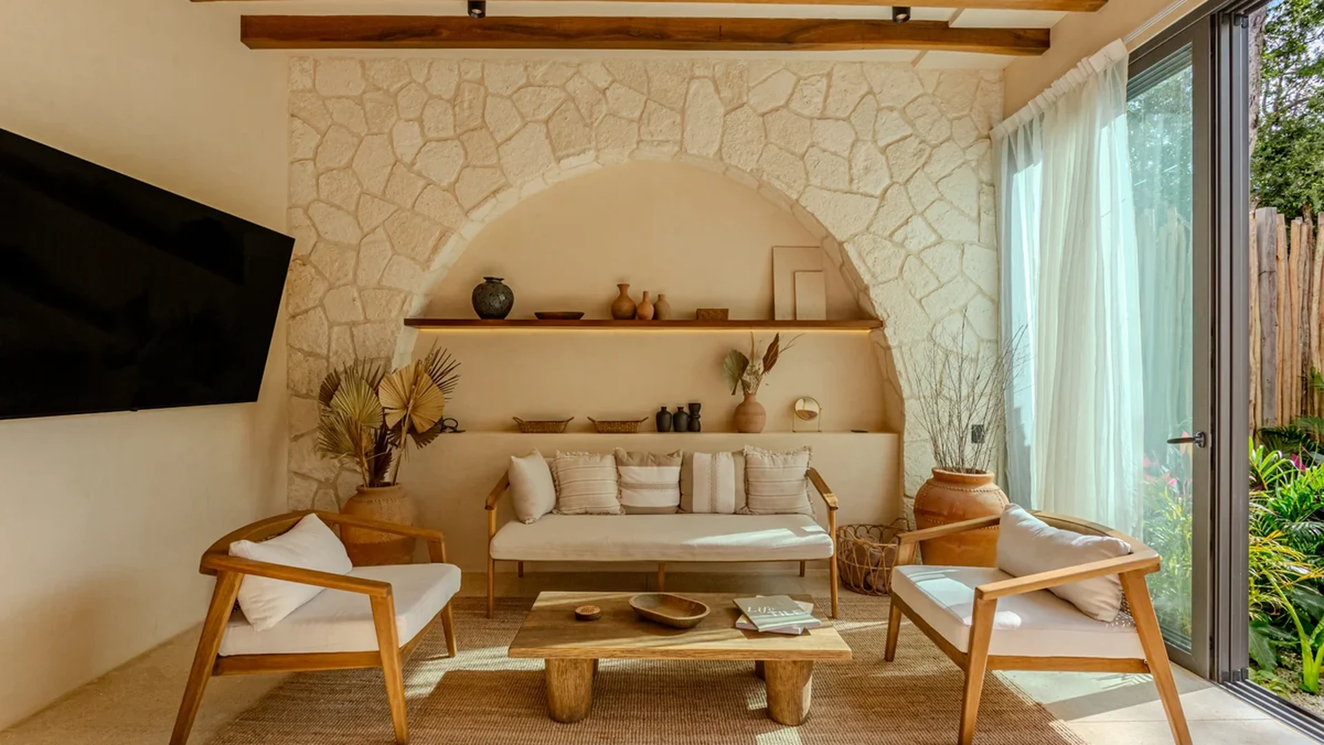 Image of a Living Room, featuring Stone Accent Wall and Exposed Wood Beams.
