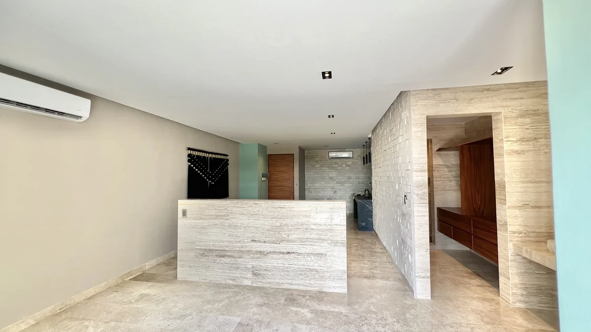 View of Unfurnished Interior at Amaru, showcasing Modern Design, Travertine Flooring.