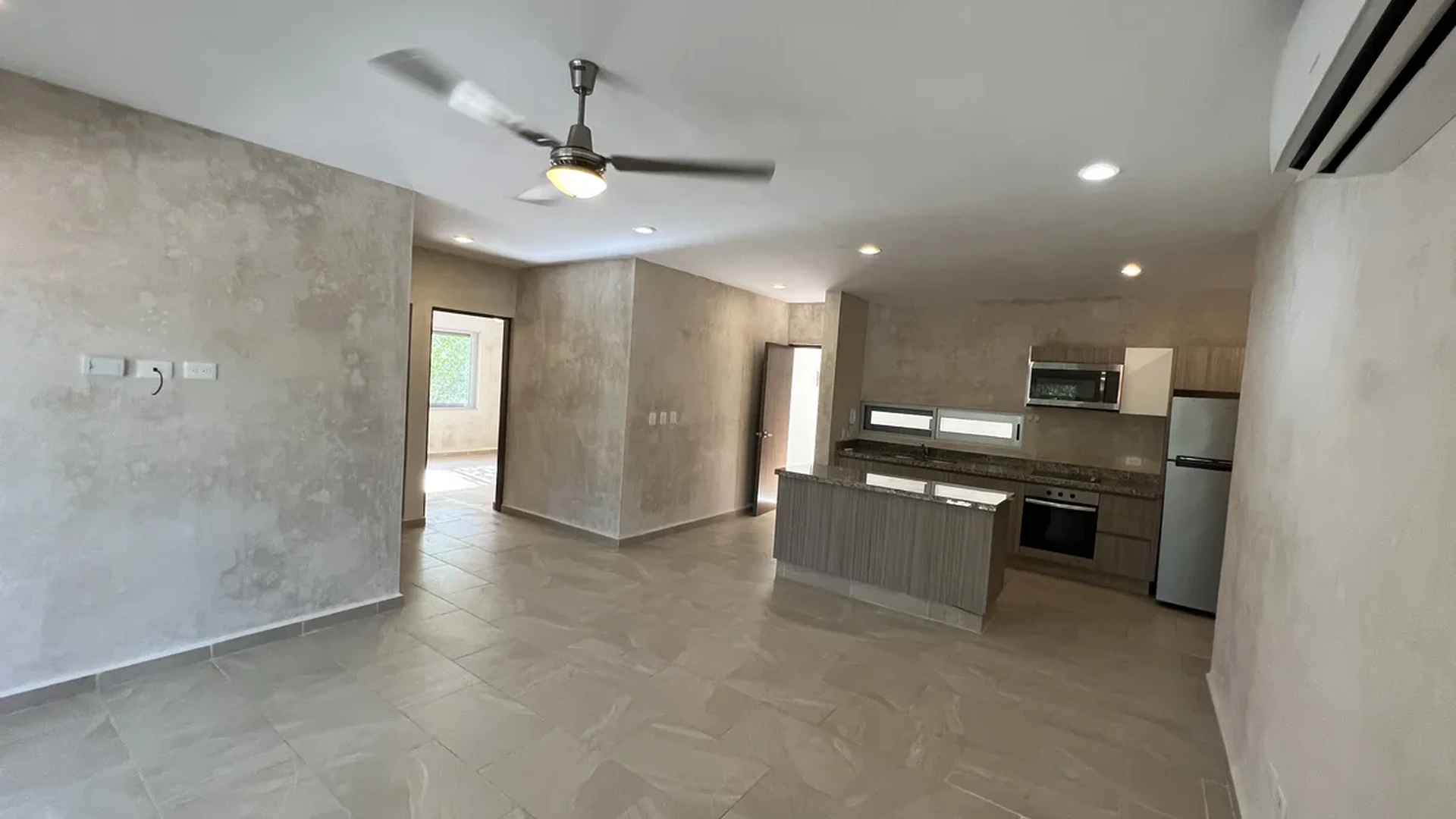 View of Open Concept Living at Carmela, showcasing Modern Kitchen, Kitchen Island.