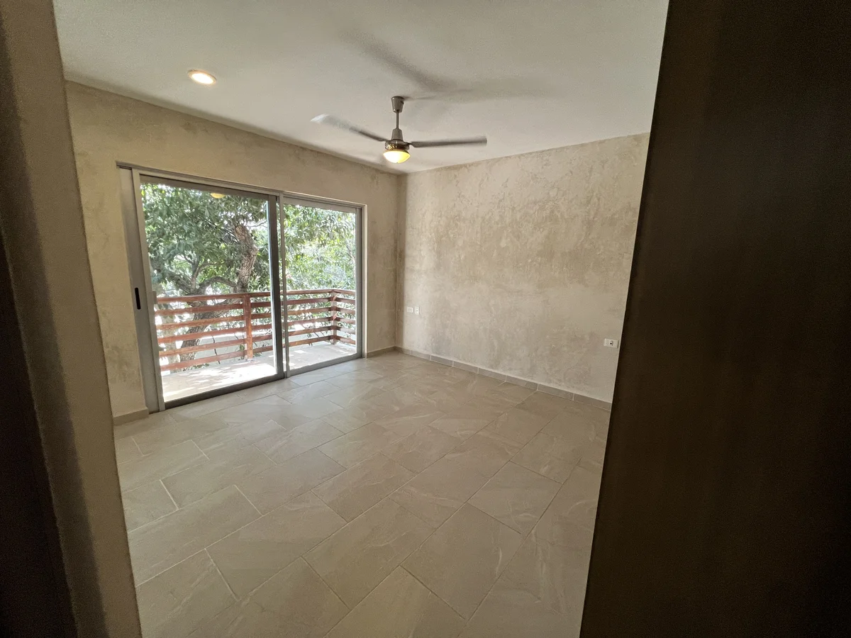 View of Unfurnished Room at Carmela, showcasing Spacious Interior, Tile Flooring.