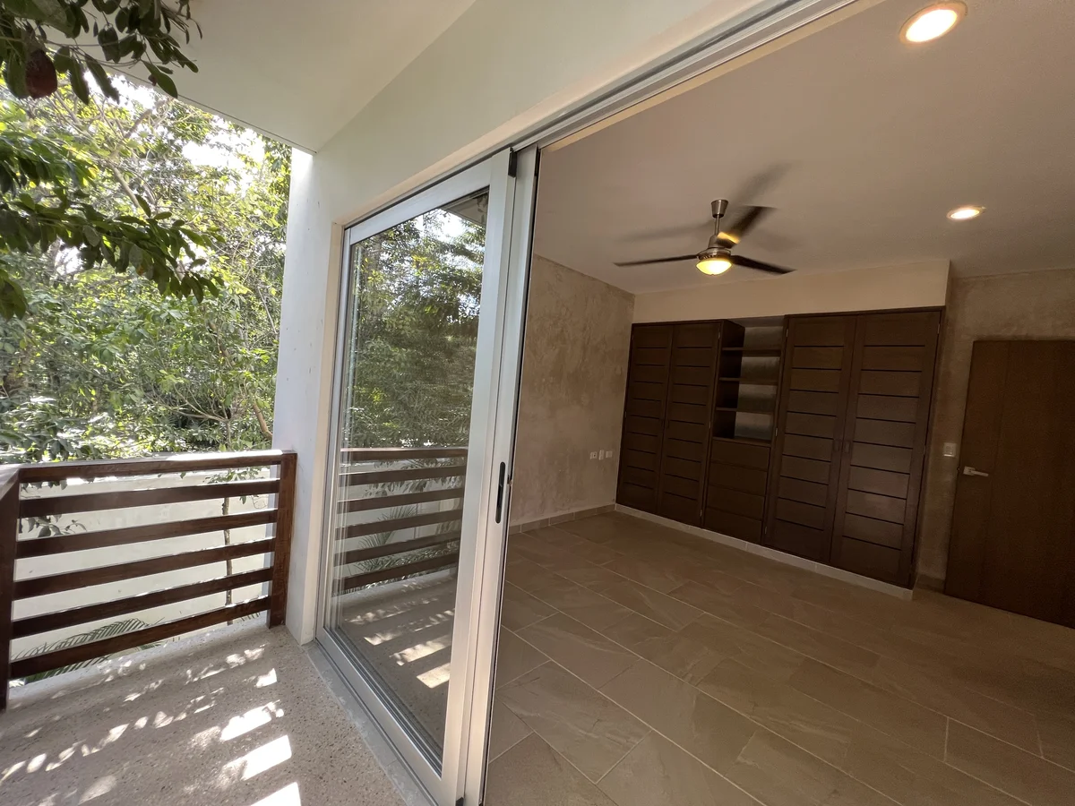 View of Spacious Bedroom at Carmela, showcasing Natural Light, Private Balcony.