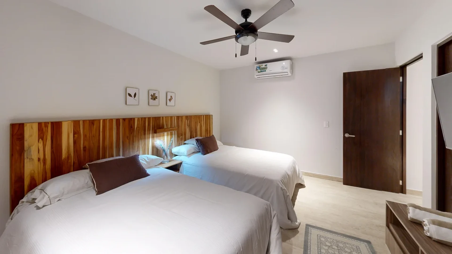 View of Modern Bedroom at Costa Caribe, showcasing Twin Beds, Wood Headboard.