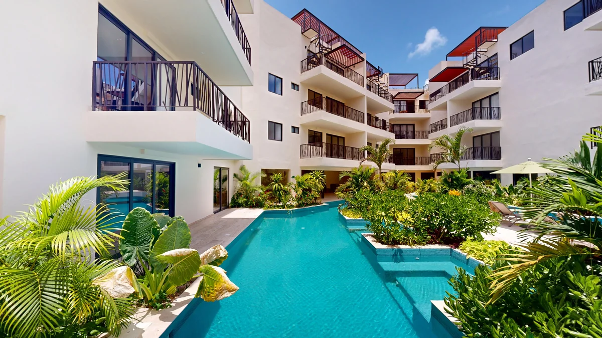Image of Swimming Pool at Costa Caribe, featuring Modern Architecture, Luxury Apartments.