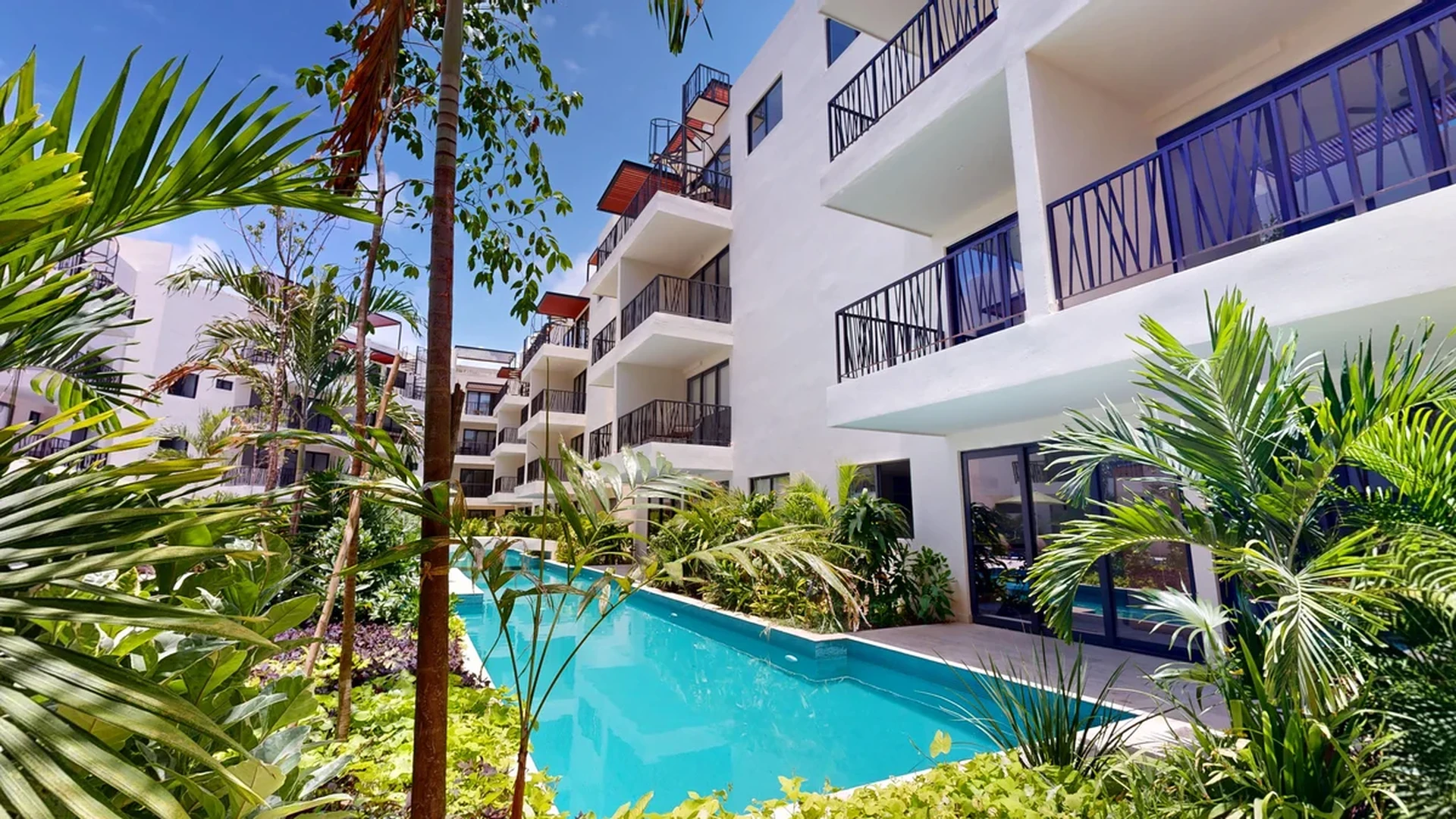 Image of Swimming Pool at Costa Caribe, featuring Modern Architecture, Residential Building.