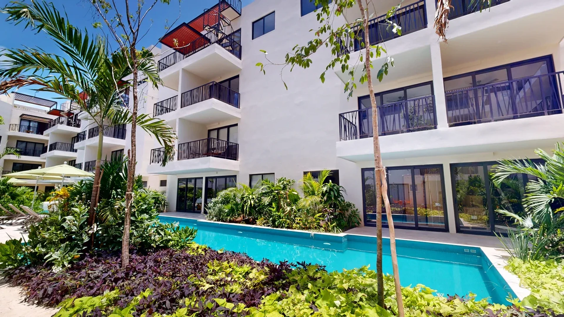 Image of Swimming Pool at Costa Caribe, featuring Modern Architecture, Residential Complex.