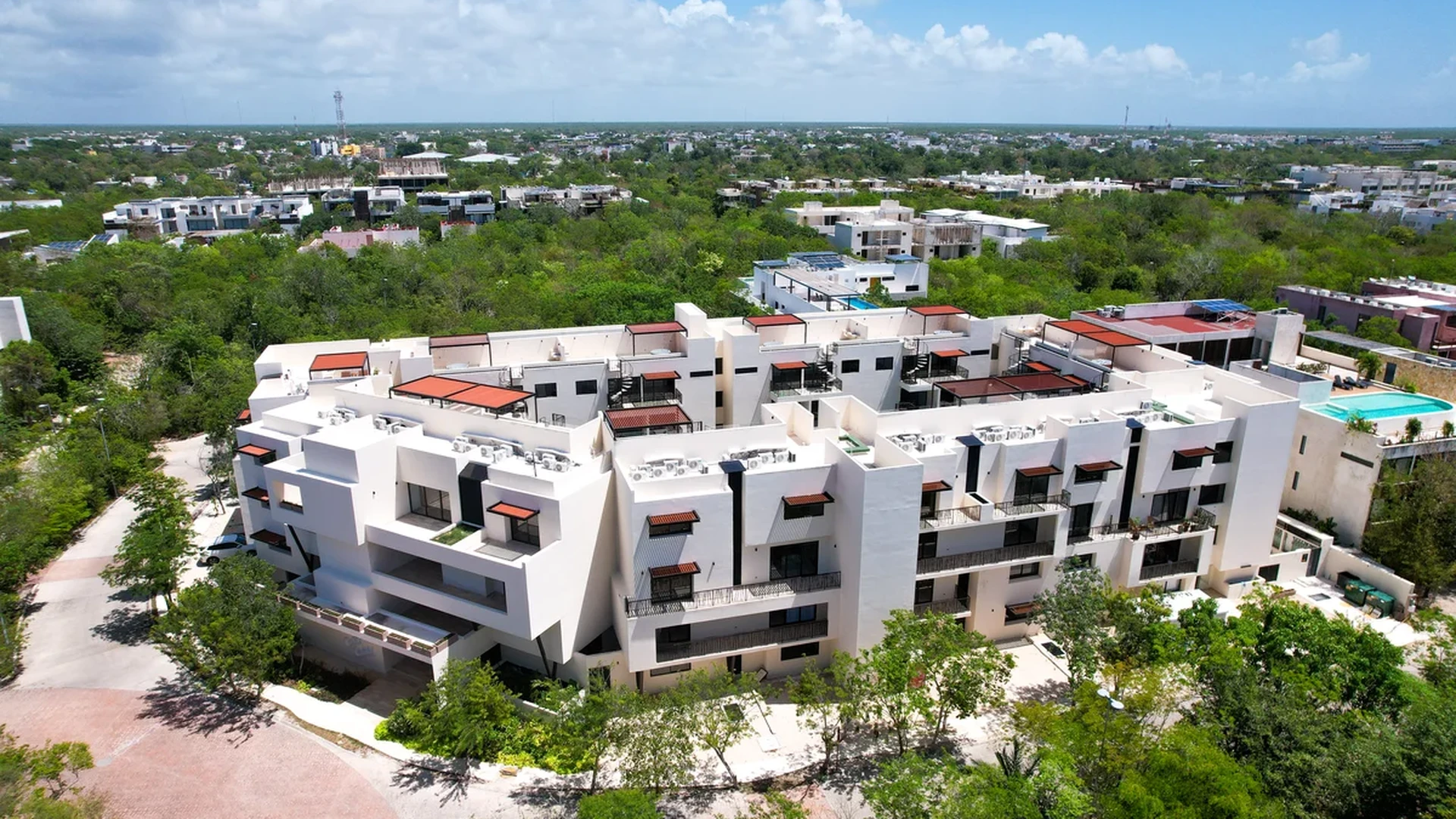 Image of Swimming Pool at Costa Caribe, featuring Modern Architecture, Residential Complex.