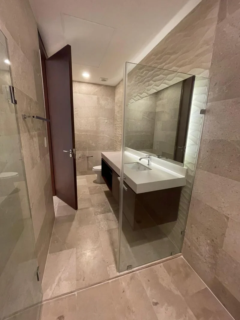 View of Modern Bathroom at Cruz con Mar, showcasing Contemporary Design, Stone Wall Tiles.