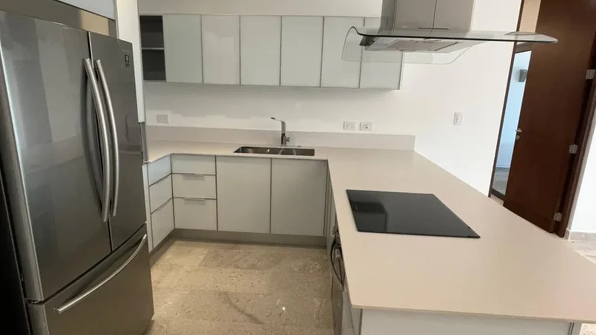 View of Modern Kitchen at Cruz con Mar, showcasing Stainless Steel Appliances, Induction Cooktop.
