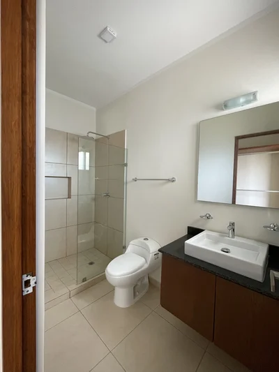 View of Bathroom at Inzignia, showcasing Modern Bathroom, Walk-in Shower.
