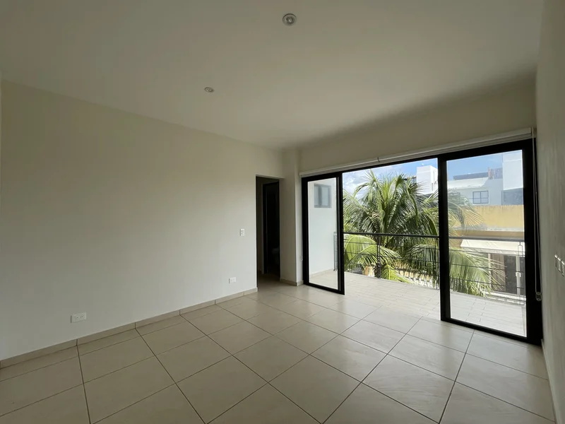 View of Empty Room at Inzignia, showcasing Tile Flooring, Sliding Glass Door.