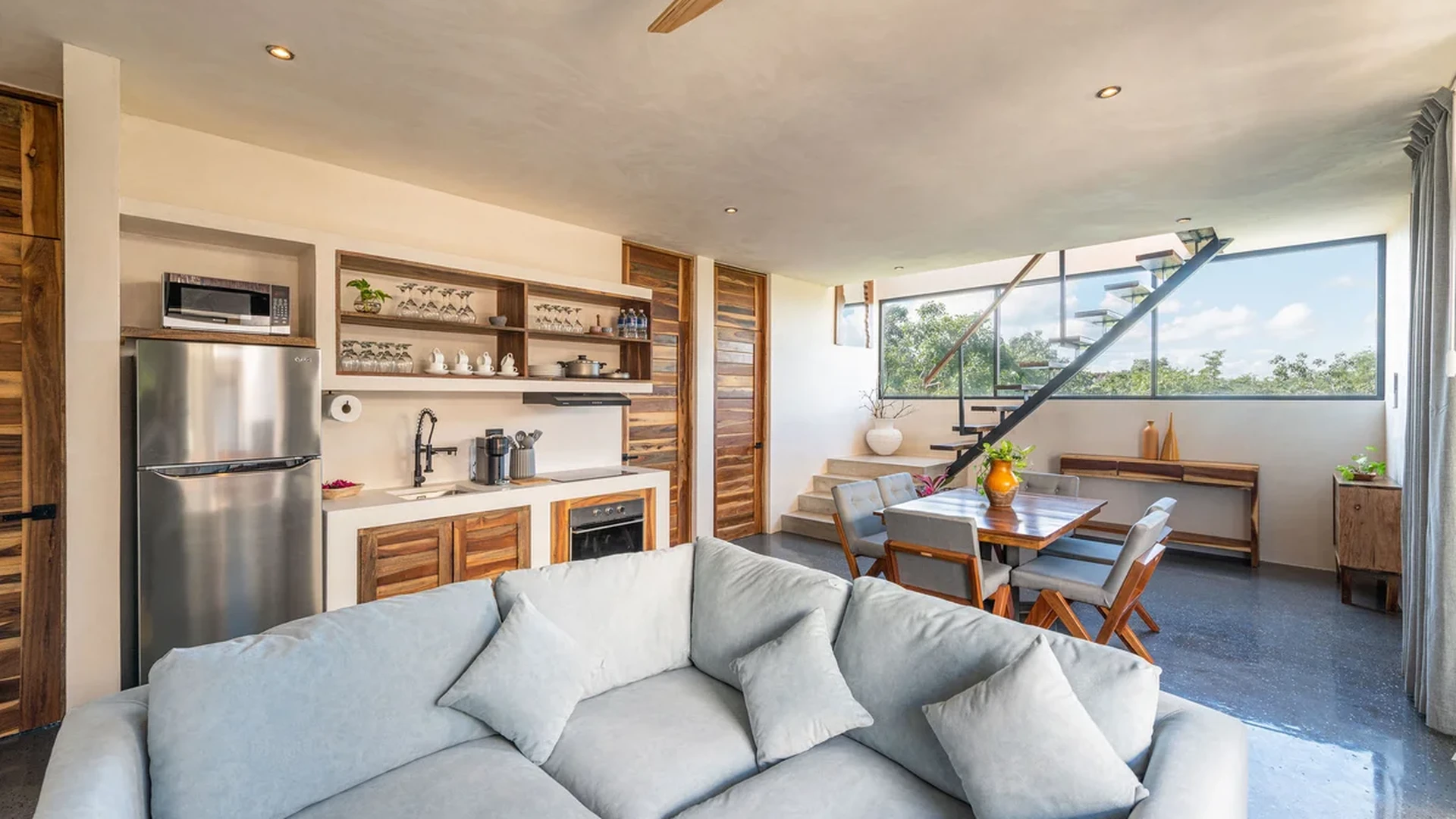 View of Open Concept Living at Irie, showcasing Modern Kitchen, Dining Area.