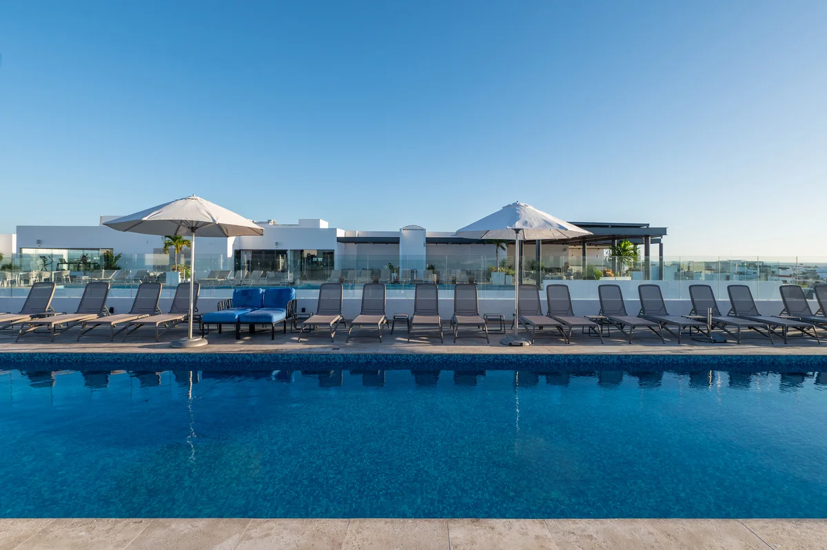 Image of Swimming Pool at Ipana, featuring Rooftop Pool, Modern Poolside.