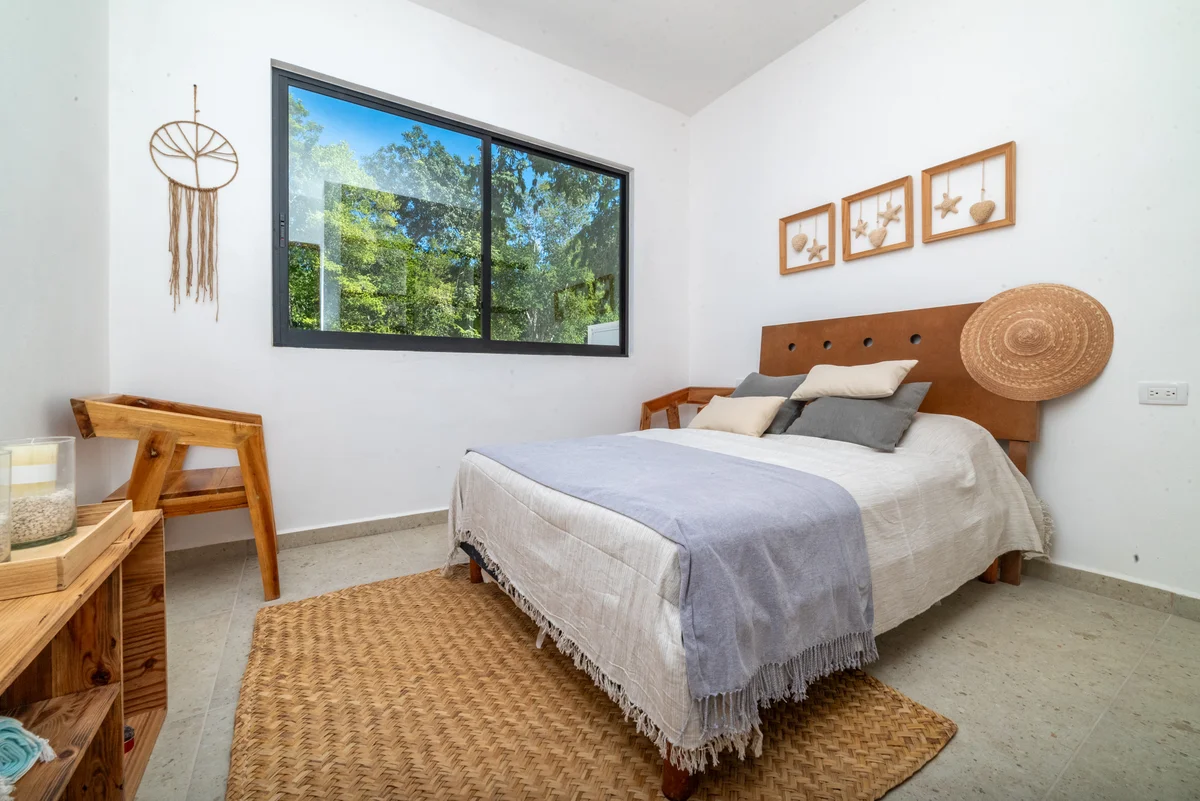 View of Bedroom Interior at Kim-Koba, showcasing Natural Light, Minimalist Design.