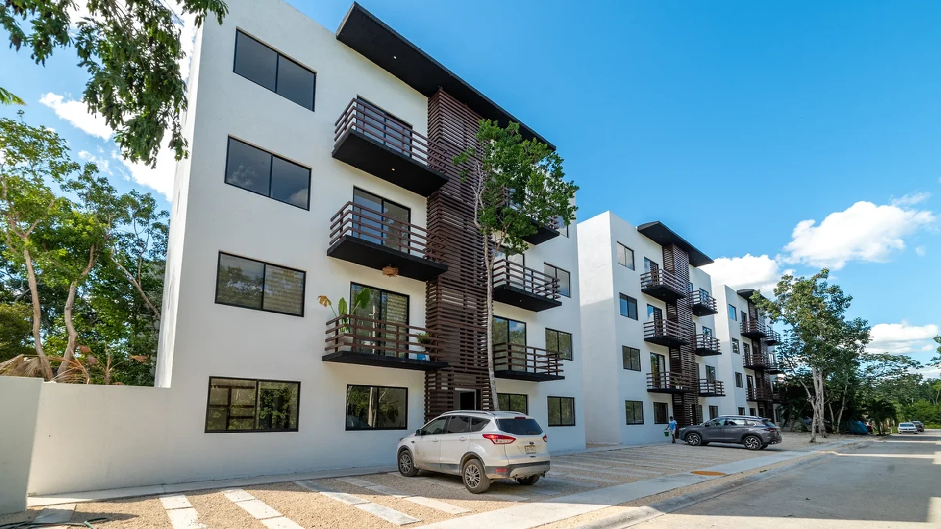 Image of Parking at Kim-Koba, featuring Modern Architecture, Apartment Building.