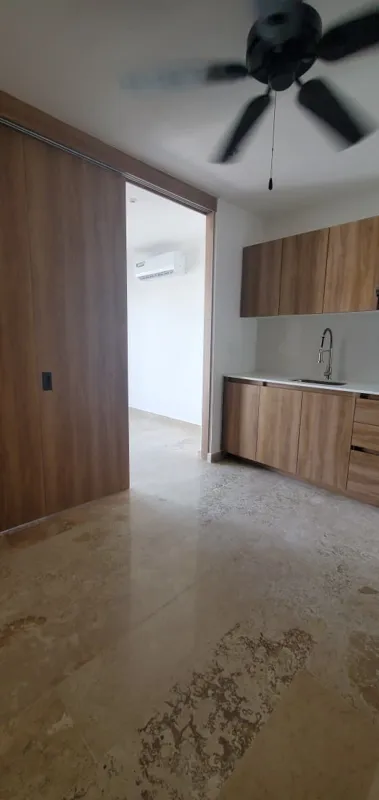 A collection of interior and balcony photos from Lik Xelba, showcasing a finished bedroom with a wooden wardrobe, ceiling fan, air conditioning, and a balcony with a spiral staircase, alongside a modern bathroom with a white sink, toilet, and glas...