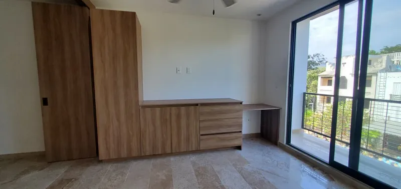 A collection of interior and balcony photos from Lik Xelba, showcasing a finished bedroom with a wooden wardrobe, ceiling fan, air conditioning, and a balcony with a spiral staircase, alongside a modern bathroom with a white sink, toilet, and glas...