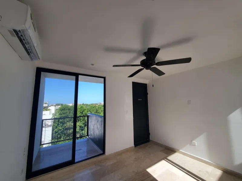 A collection of interior and balcony photos from Lik Xelba, showcasing a finished bedroom with a wooden wardrobe, ceiling fan, air conditioning, and a balcony with a spiral staircase, alongside a modern bathroom with a white sink, toilet, and glas...