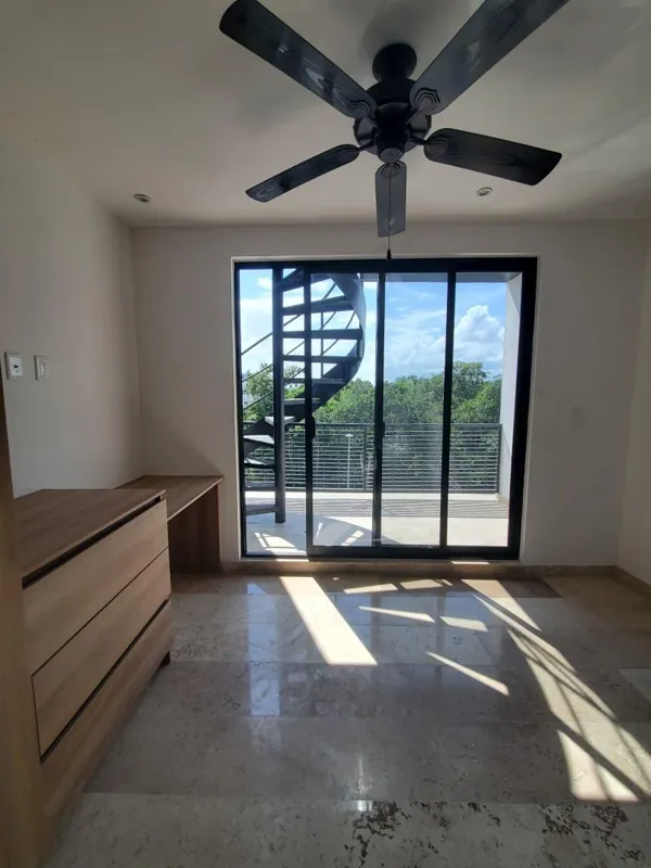 A collection of interior and balcony photos from Lik Xelba, showcasing a finished bedroom with a wooden wardrobe, ceiling fan, air conditioning, and a balcony with a spiral staircase, alongside a modern bathroom with a white sink, toilet, and glas...