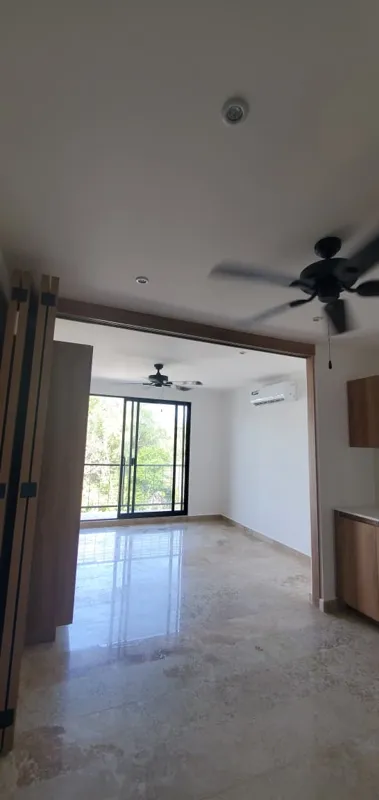 A collection of interior and balcony photos from Lik Xelba, showcasing a finished bedroom with a wooden wardrobe, ceiling fan, air conditioning, and a balcony with a spiral staircase, alongside a modern bathroom with a white sink, toilet, and glas...