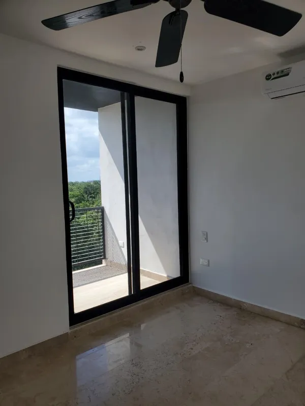 A collection of interior and balcony photos from Lik Xelba, showcasing a finished bedroom with a wooden wardrobe, ceiling fan, air conditioning, and a balcony with a spiral staircase, alongside a modern bathroom with a white sink, toilet, and glas...