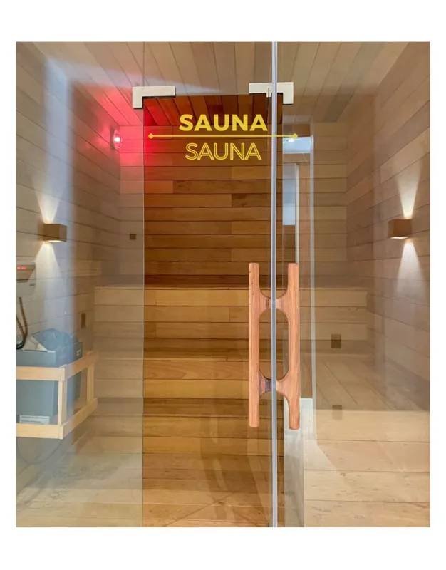 A collection of eight images displaying the finished amenities at Amari Tulum, including a spacious yoga and wellness center with large glass doors, a modern full-featured gym with various exercise equipment, a wooden sauna room, a refreshing cold...