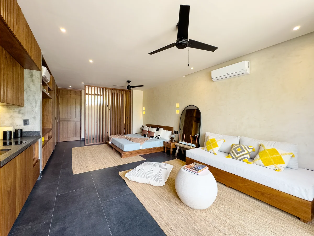 View of Studio Apartment at Mestiza 15, showcasing Modern Interior Design, Wood Accents.