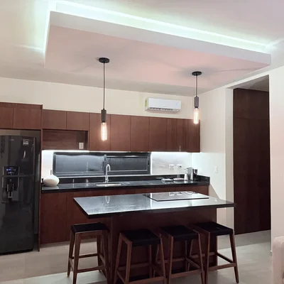 View of Modern Kitchen at AAK, showcasing Kitchen Island, Dark Wood Cabinetry.