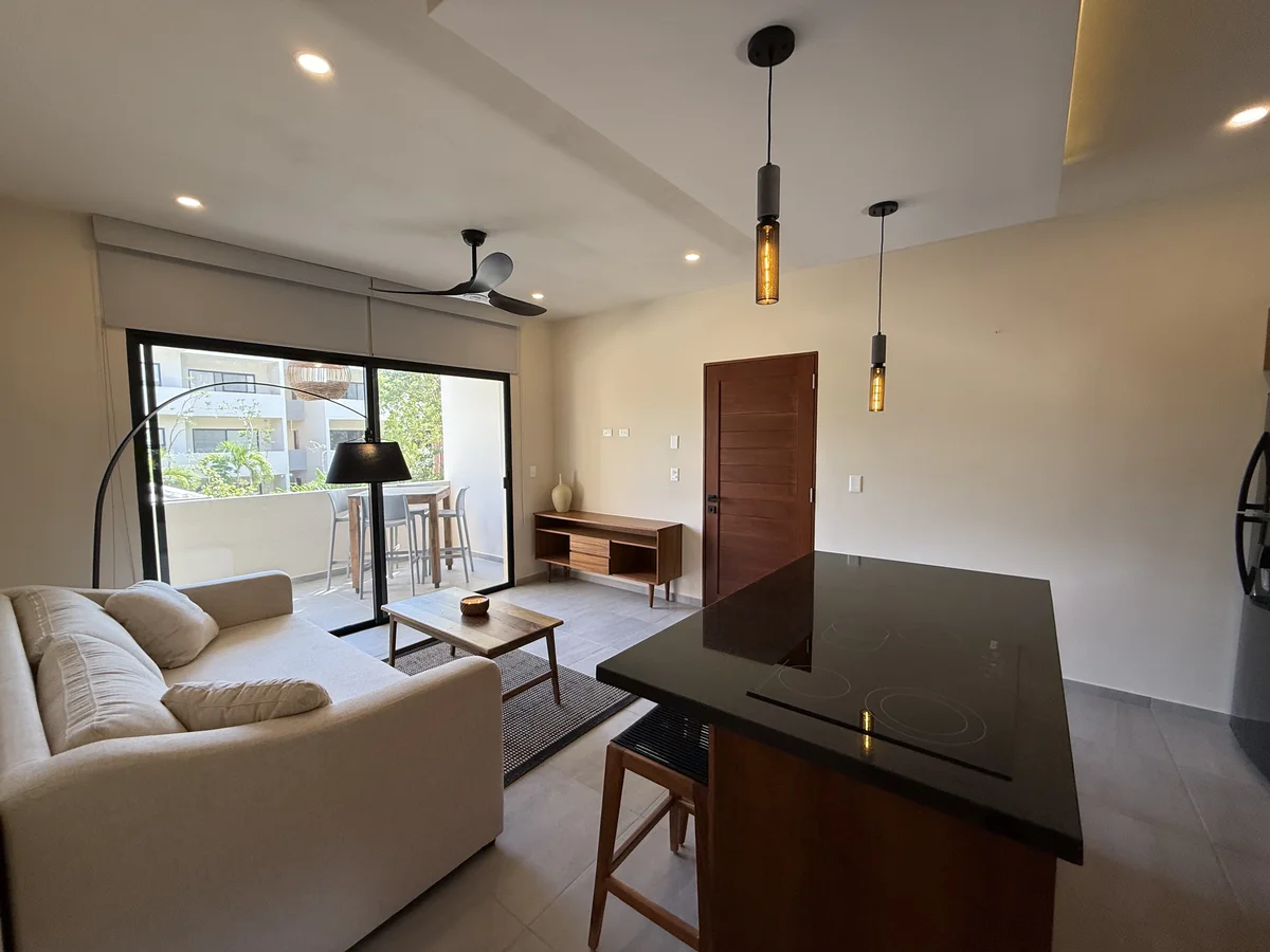 View of Modern Living Room at AAK, showcasing Open Concept Kitchen, Contemporary Interior.