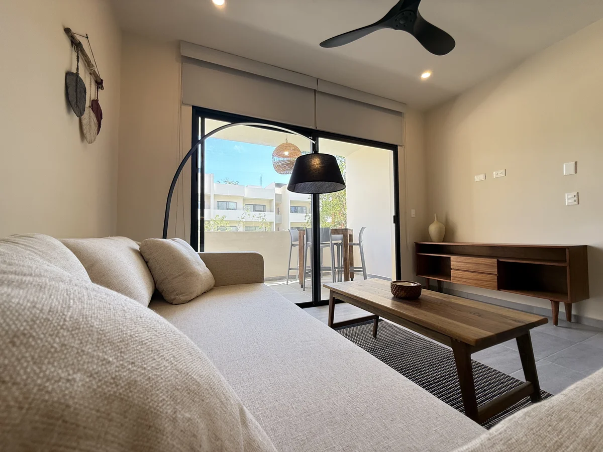 View of Living Room at AAK, showcasing Modern Interior, Private Balcony.